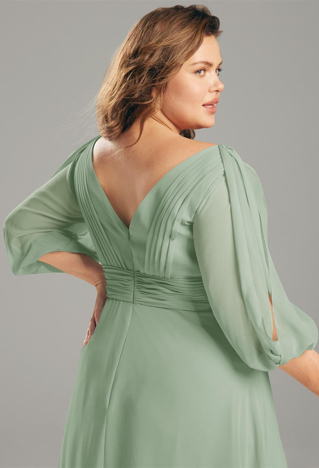 The back view of a Polly - Chiffon Bridesmaid Dress - Off the Rack in sage green plus size available at Bergamot Bridal, a bridal shop in London.