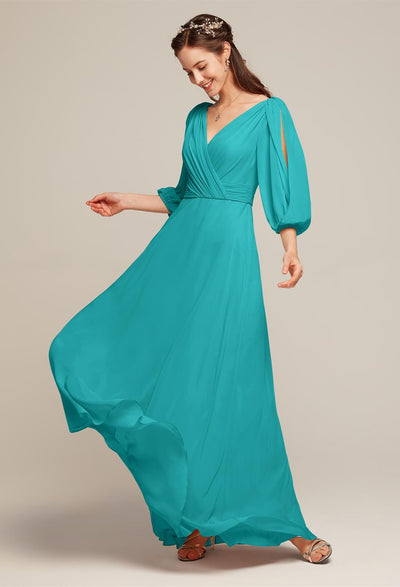 The bridesmaid is wearing a teal long Polly - Chiffon Bridesmaid Dress - Off the Rack from Bergamot Bridal in London.