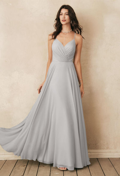 A bridesmaid in a grey chiffon dress from Bergamot Bridal's Melody - Chiffon Bridesmaid Dress - Off the Rack from bridal shops in London.