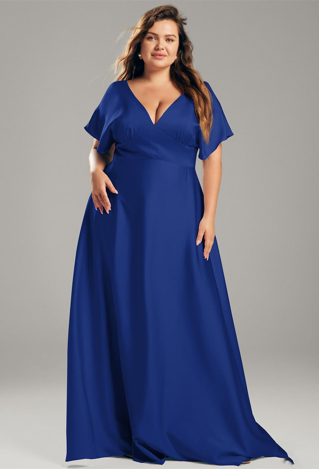 A bridesmaid in a Nora - Satin Charmeuse Bridesmaid Dress - Off The Rack by Bergamot Bridal found at a bridal shop in London.