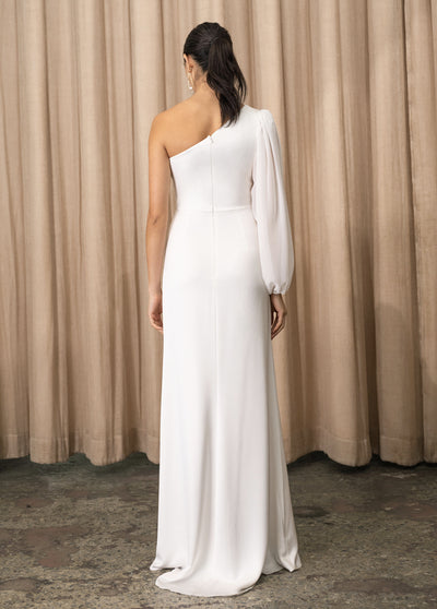The back view of a woman wearing a stunning white one shoulder Cressida - Jenny Yoo Little White Dress, perfect for a wedding day from Bergamot Bridal.