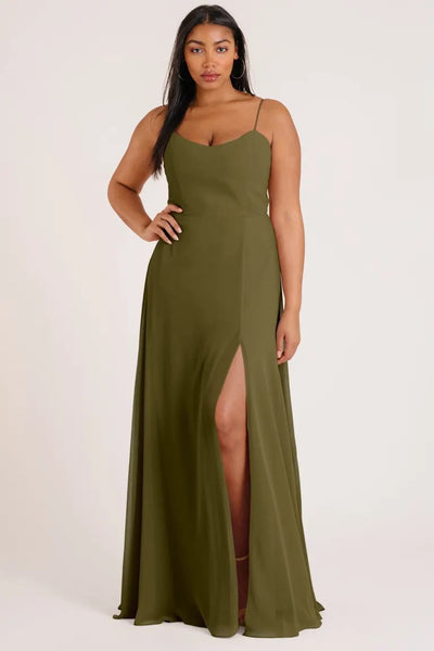 Woman in a luxe chiffon, olive green Kiara - Bridesmaid Dress by Jenny Yoo with a thigh-high slit and an A-line skirt from Bergamot Bridal.