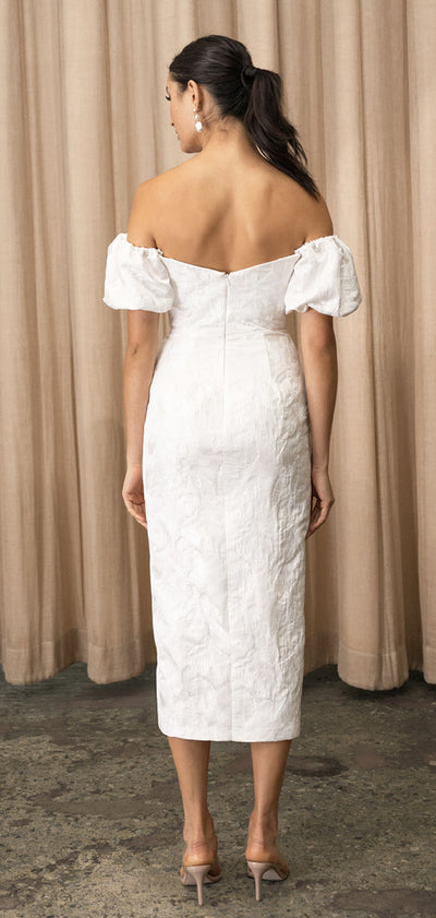 The back view of a woman wearing a Marilyn - Jenny Yoo Little White Dress by Bergamot Bridal wedding dress.