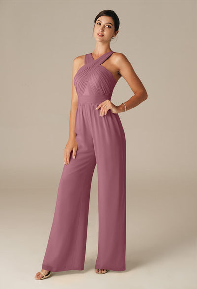 A woman in a mauve halter neck jumpsuit with pleated detail, standing elegantly against a neutral background, reminiscent of bridal shops in London. - Lorraine - Chiffon Bridesmaid Jumpsuit - Off The Rack by Bergamot Bridal