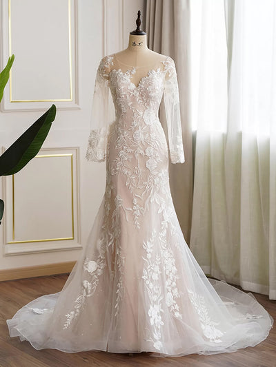 An elegant Ultimate Floral Fit and Flare Long Sleeve Wedding Dress - Off The Rack with lace appliqué by Bergamot Bridal on a mannequin.