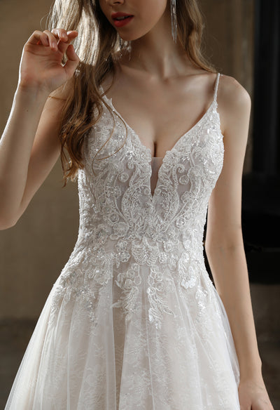 A beautiful bride in a Beaded A-Line Wedding Dress with Spaghetti Straps from Bergamot Bridal in London.