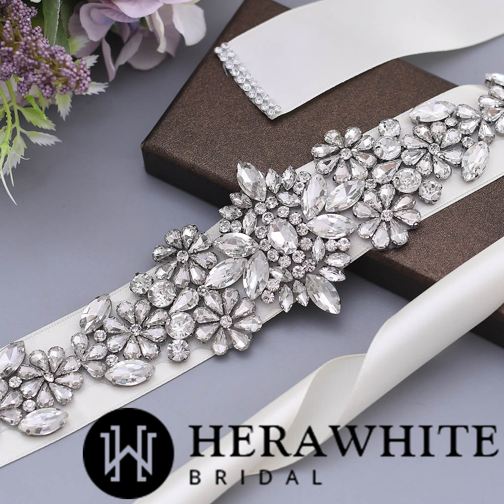 The Sparkly Crystals Satin Bridal Sash by Bergamot Bridal can be found in bridal shops.