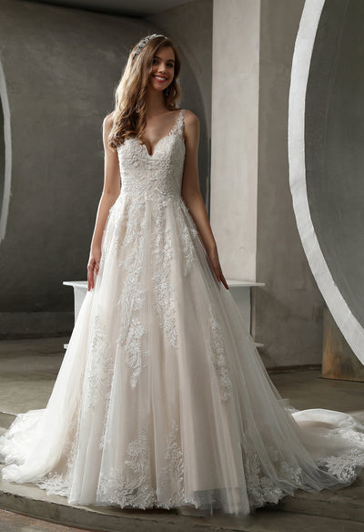 A stunning Tulle Lace Ball Gown with Glitter Tulle Underlay by Bergamot Bridal can be found at bridal shops in London.