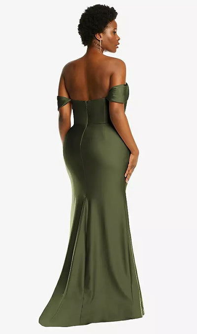 Elegantly poised, a person showcases the Off-the-Shoulder Corset Stretch Satin Mermaid Bridesmaid Dress with Slight Train in olive green by Bergamot Bridal, Style CS101 by Dessy. The gown gracefully cascades into a mermaid skirt as they turn away, capturing a timeless silhouette.