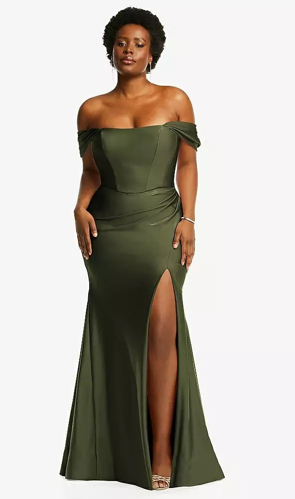 A person in the Off-the-Shoulder Corset Stretch Satin Mermaid Bridesmaid Dress with Slight Train - Style CS101 by Dessy from Bergamot Bridal stands confidently.