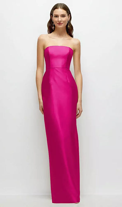 A woman in the Strapless Satin Column Bridesmaid Dress with Back Slit by Alfred Sung, Style D877 from Bergamot Bridal, poses gracefully against a plain white background.