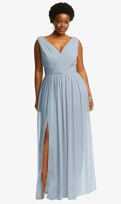 A woman poses against a white backdrop, wearing the Bergamot Bridal Sleeveless Draped Chiffon Maxi Dress by Dessy (Style 2894) in light blue. This elegant, floor-length gown features a V-neck and a chic front slit.