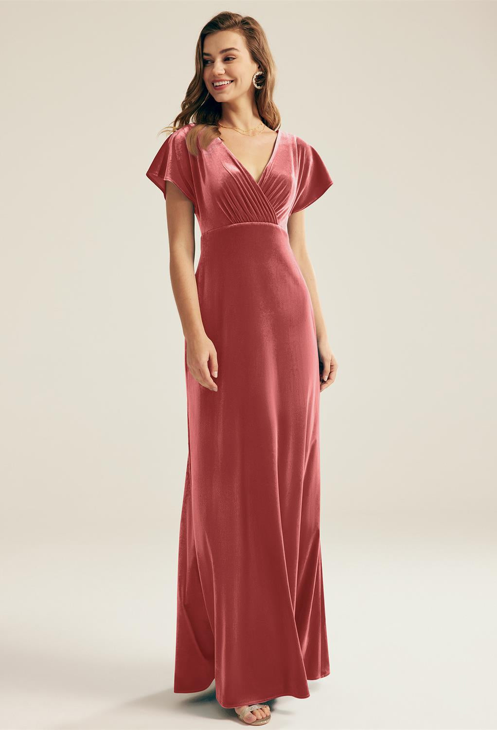 A woman wearing a Meara - Velvet Bridesmaid Dress - Off The Rack found at Bergamot Bridal in London.