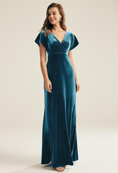 A plus size woman wearing a Meara - Velvet Bridesmaid Dress - Off The Rack in London from the brand Bergamot Bridal.