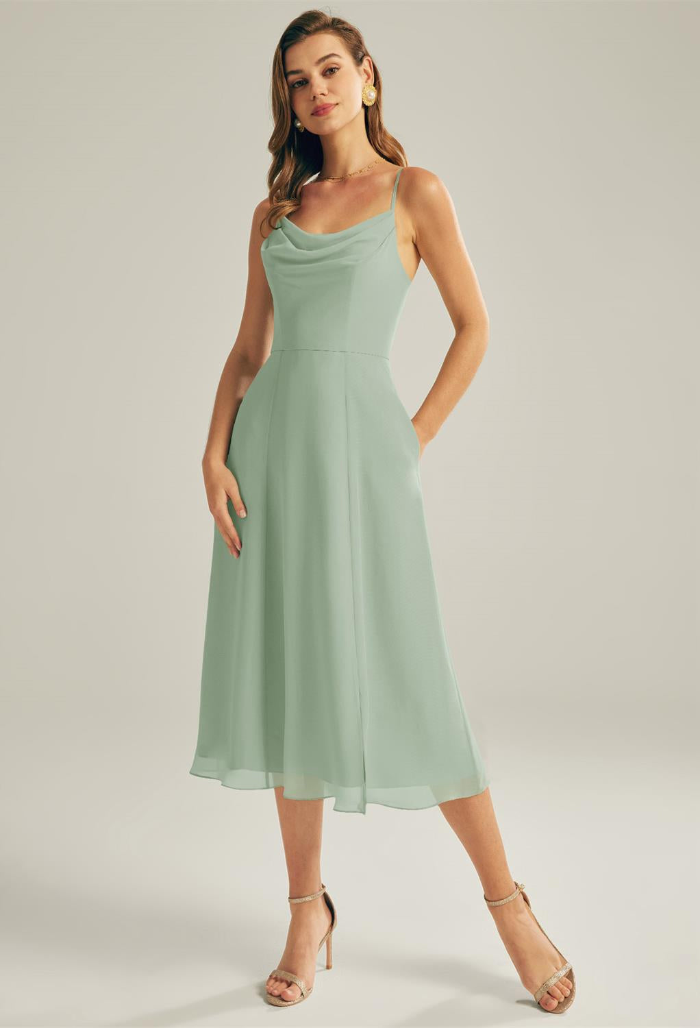 A woman in a green dress visited Bergamot Bridal, a bridal shop in London, to try on Maribel - Chiffon Bridesmaid Dress - Off the Rack.