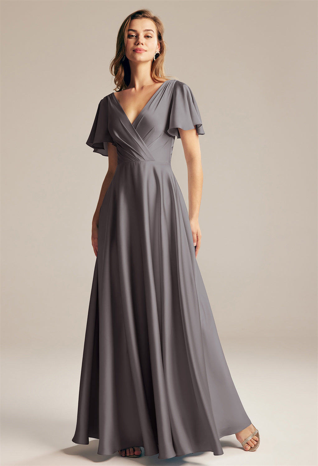 The bridesmaid is wearing a Furst - Satin Charmeuse Bridesmaid Dress - Off The Rack dress by Bergamot Bridal.