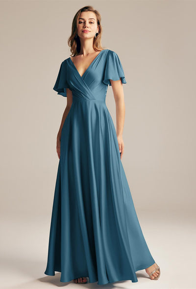 The bridesmaid is wearing a Furst - Satin Charmeuse Bridesmaid Dress - Off The Rack with a v-neck from one of the bridal shops in London, Bergamot Bridal.