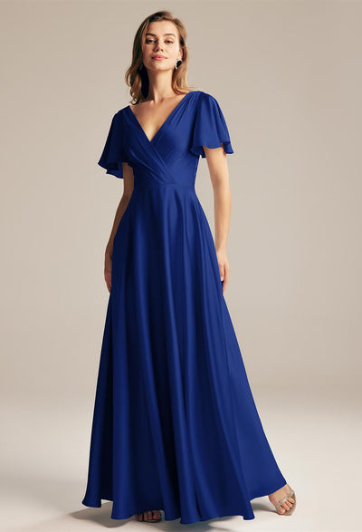 A woman wearing a Furst - Satin Charmeuse Bridesmaid Dress - Off The Rack in London, by Bergamot Bridal.