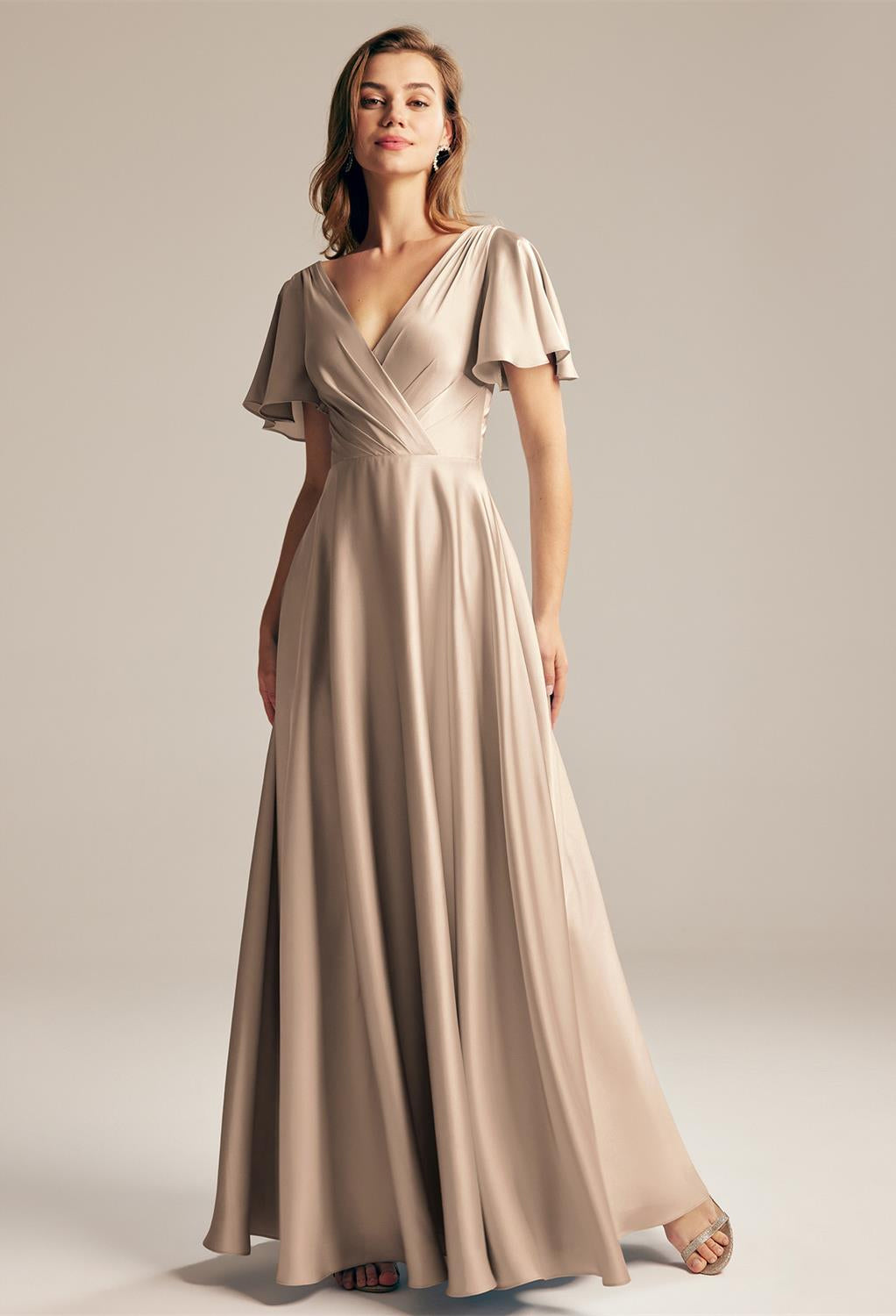 The bridesmaid is wearing a Furst - Satin Charmeuse Bridesmaid Dress - Off The Rack with a v-neck from Bergamot Bridal.