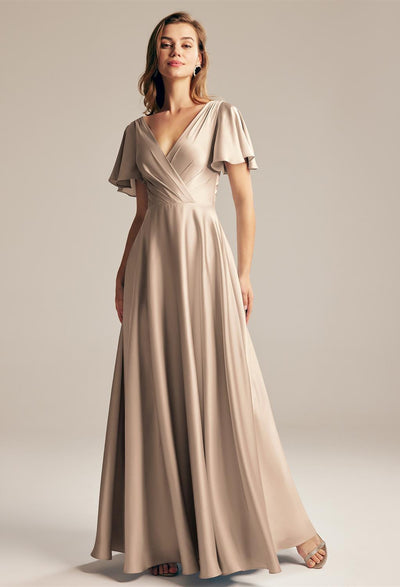 The bridesmaid is wearing a Furst - Satin Charmeuse Bridesmaid Dress - Off The Rack with a v-neck from Bergamot Bridal.