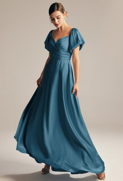 The Dey - Satin Charmeuse Bridesmaid Dress - Off The Rack in teal with a v-neck is available at Bergamot Bridal shops in London.