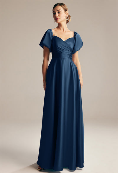 The bridesmaid is wearing a navy blue Dey - Satin Charmeuse Bridesmaid Dress - Off The Rack from Bergamot Bridal in London.