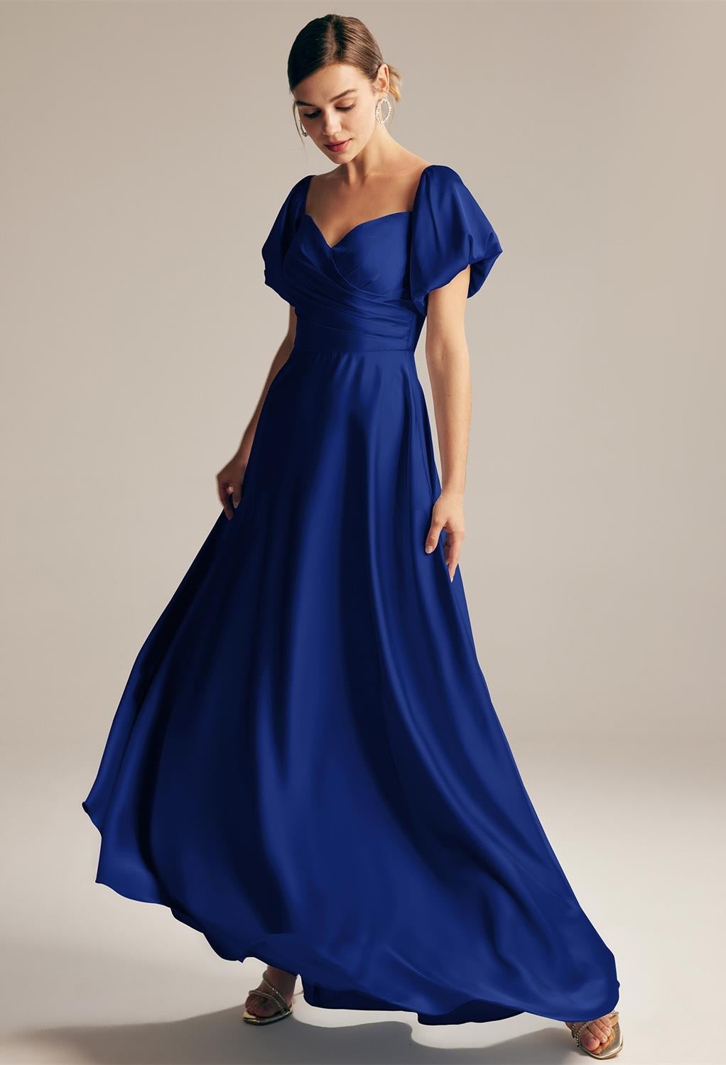 A woman wearing the Dey - Satin Charmeuse Bridesmaid Dress - Off The Rack, by Bergamot Bridal, in London.