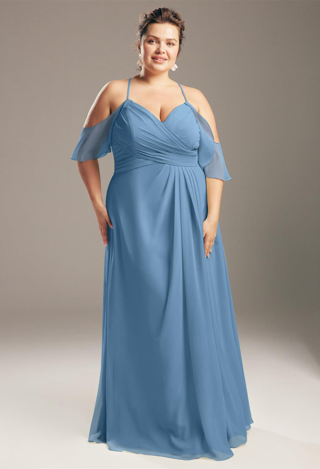 A plus size bridesmaid in a blue dress looking for the Jenifer - Chiffon Bridesmaid Dress - Off the Rack from Bergamot Bridal in London.