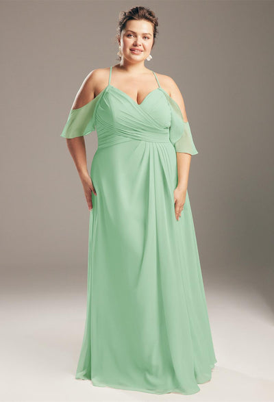 A plus size bridesmaid in a mint green Jenifer - Chiffon Bridesmaid Dress - Off the Rack by Bergamot Bridal found at a bridal shop.