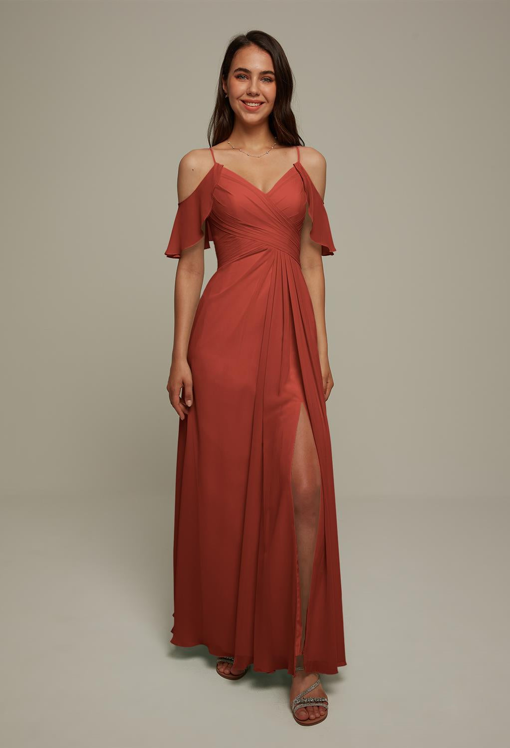 A woman wearing a "Jenifer - Chiffon Bridesmaid Dress - Off the Rack" from Bergamot Bridal.