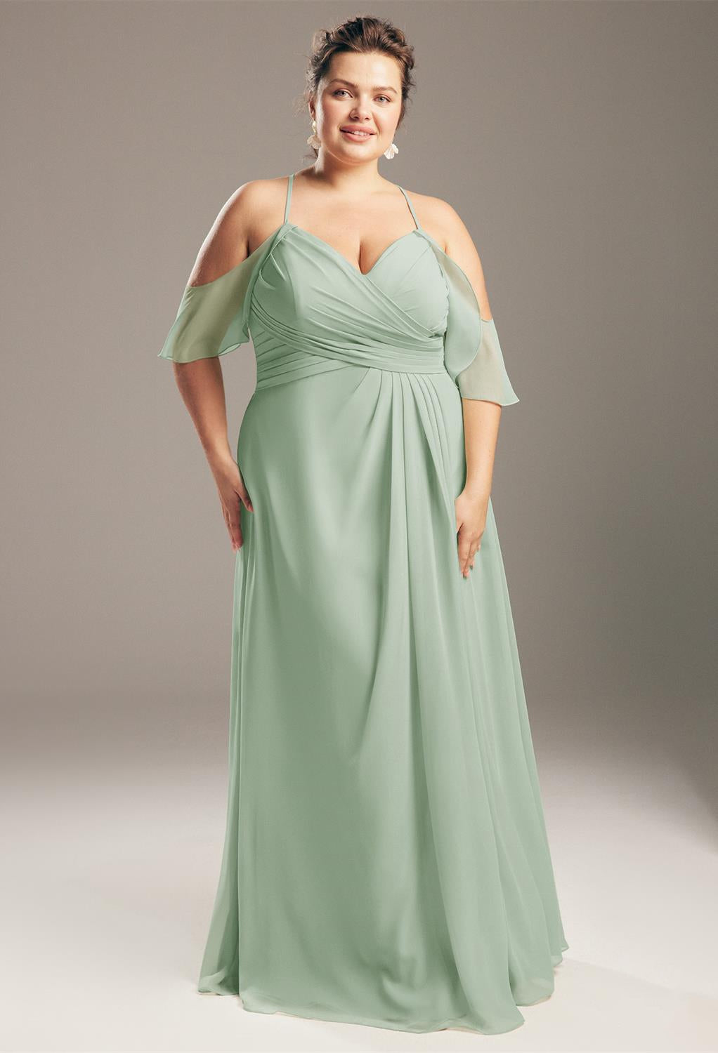 A plus size bridesmaid in a sage green "Jenifer - Chiffon Bridesmaid Dress - Off the Rack" from Bergamot Bridal.