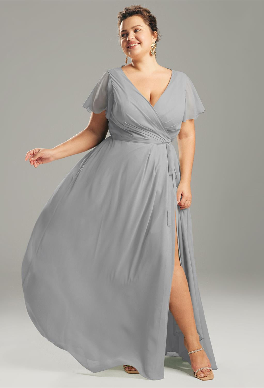 An Ellison - Chiffon Bridesmaid Dress - Off The Rack in the color grey with a split slit is available at Bergamot Bridal shops in London.