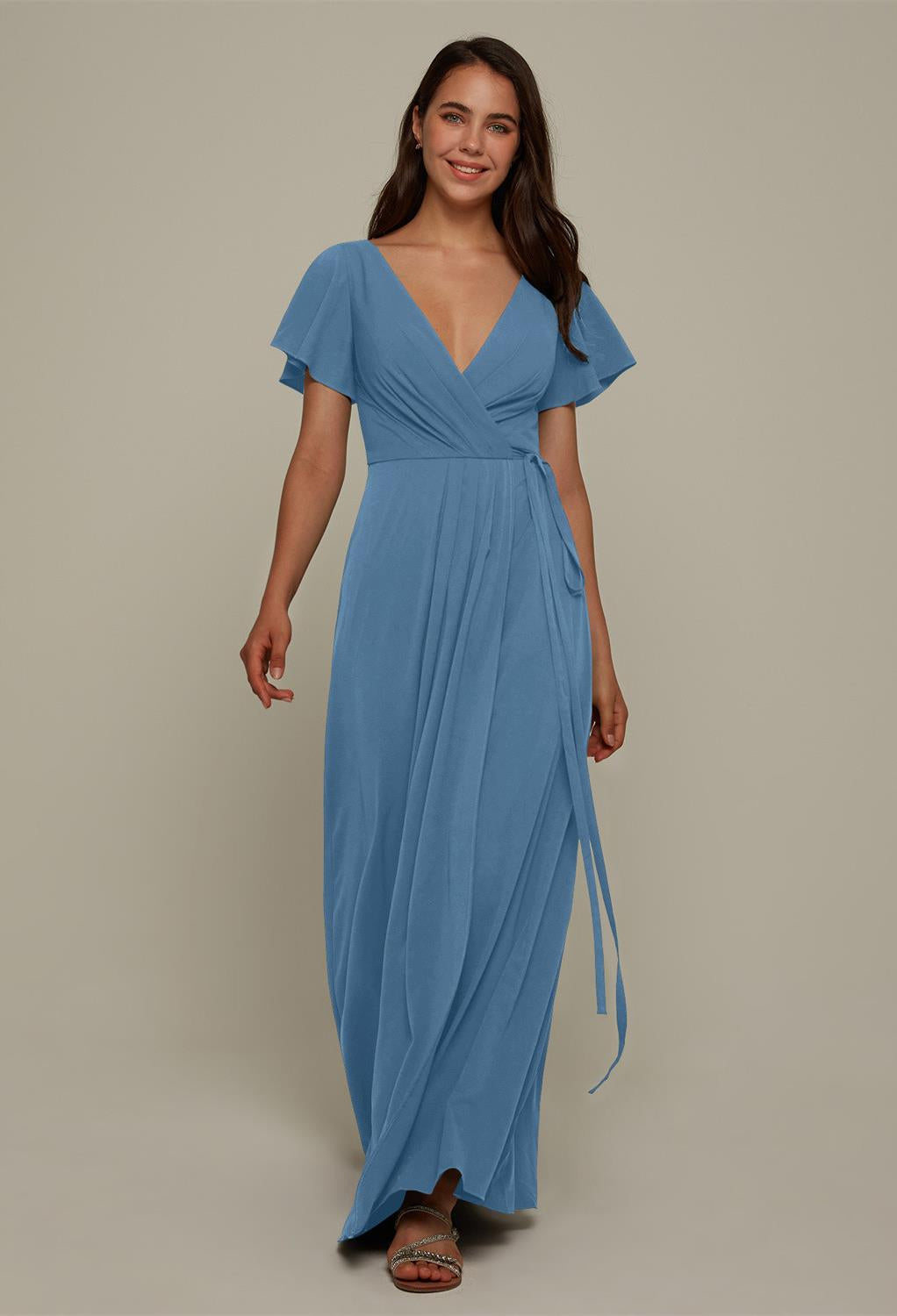 A woman wearing a blue Ellison - Chiffon Bridesmaid Dress - Off The Rack dress visited Bergamot Bridal, a bridal shop in London.