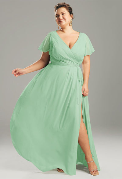 A plus size bridesmaid in an Ellison - Chiffon Bridesmaid Dress - Off The Rack from Bergamot Bridal in London with a split slit.