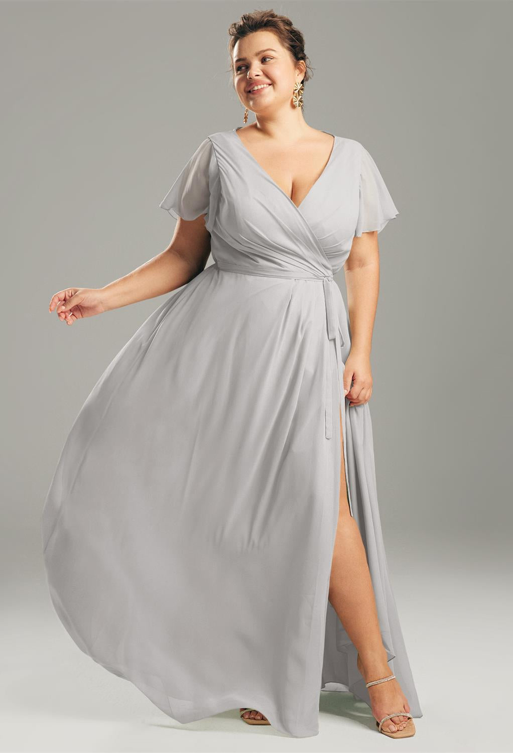 A grey Ellison - Chiffon Bridesmaid Dress - Off The Rack with a split slit is available at a London bridal shop, Bergamot Bridal.