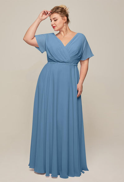 A plus size bridesmaid wearing a blue Ginny - Chiffon Bridesmaid Dress - Off The Rack dress looking for a bridesmaid dress in London.