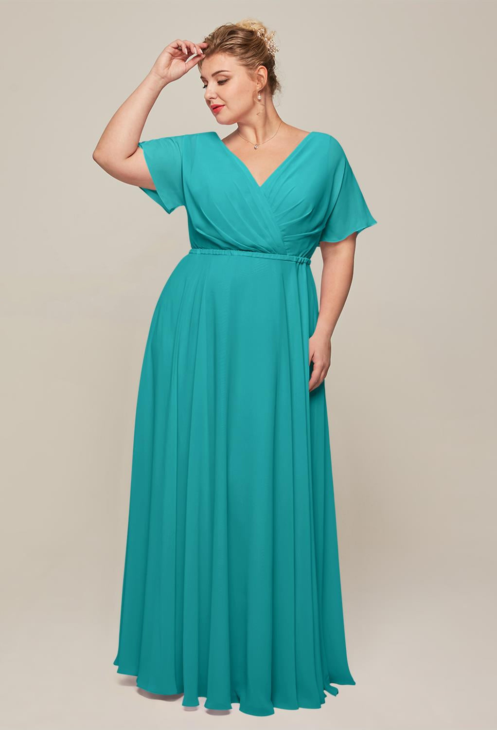 A plus size bridesmaid in London wearing a teal Ginny - Chiffon Bridesmaid Dress - Off The Rack by Bergamot Bridal.