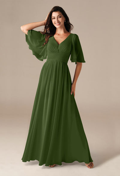 A woman wearing a Kenney - Chiffon Bridesmaid Dress - Off The Rack by Bergamot Bridal in London.