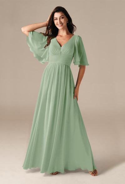 A woman wearing a Kenney - Chiffon Bridesmaid Dress - Off The Rack by Bergamot Bridal in London.