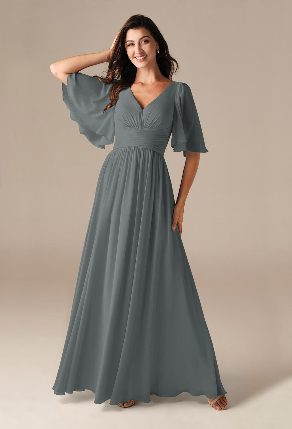 The bridesmaid is wearing a grey Kenney - Chiffon Bridesmaid Dress - Off The Rack by Bergamot Bridal.