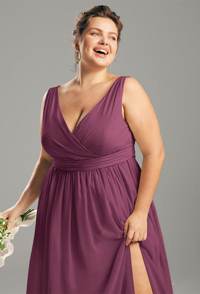 A plus size bridesmaid in a purple Hilaria - Chiffon Bridesmaid Dress - Off the Rack with a slit is shopping for a bridesmaid dress at Bergamot Bridal, a bridal shop in London.