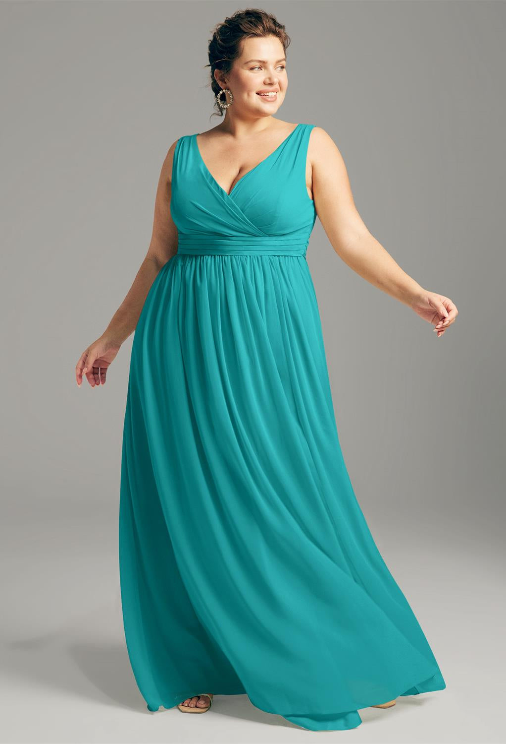 A plus size bridesmaid in a Hilaria - Chiffon Bridesmaid Dress - Off the Rack by Bergamot Bridal.