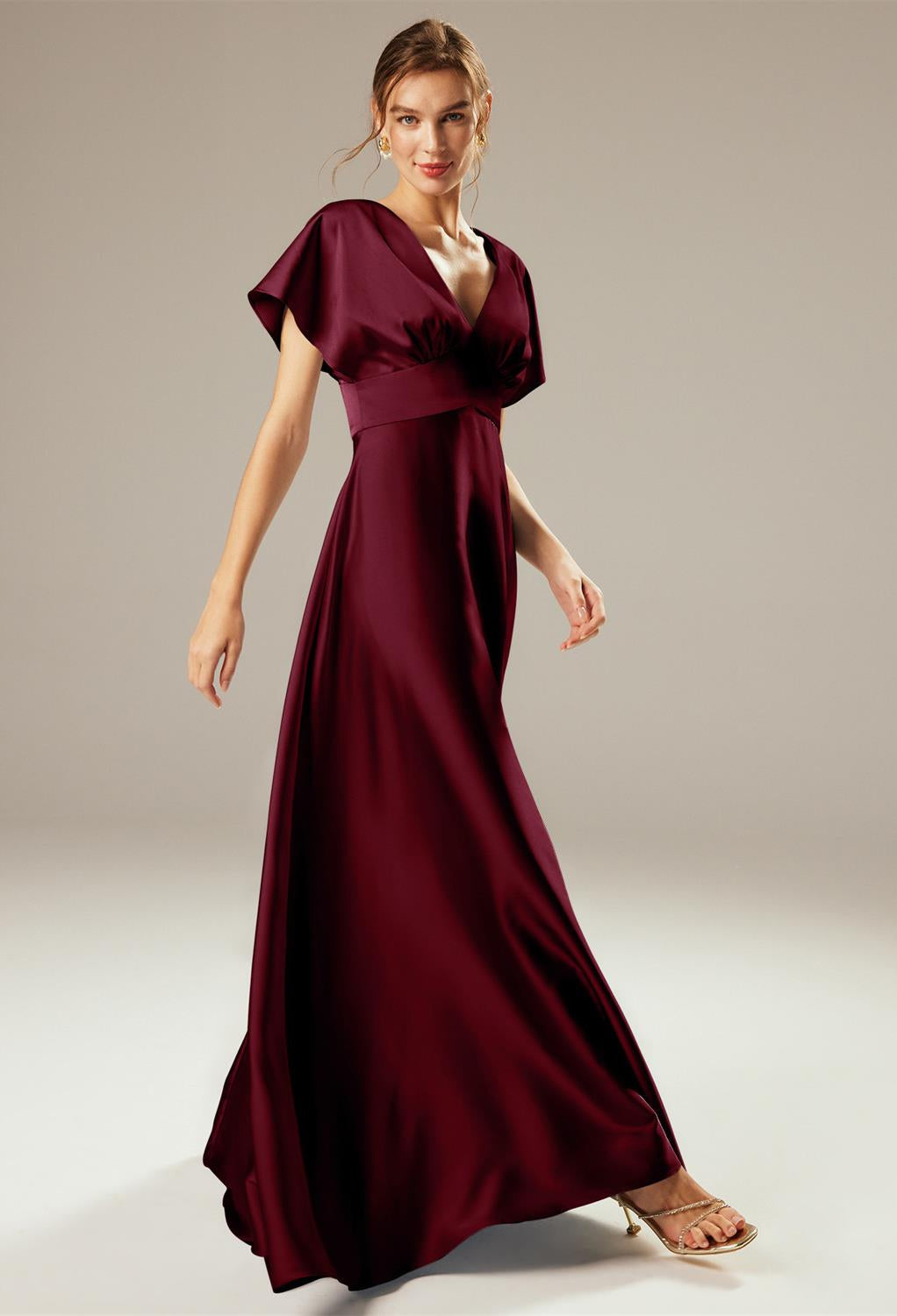 A woman wearing a Nora - Satin Charmeuse Bridesmaid Dress - Off The Rack in London by Bergamot Bridal.