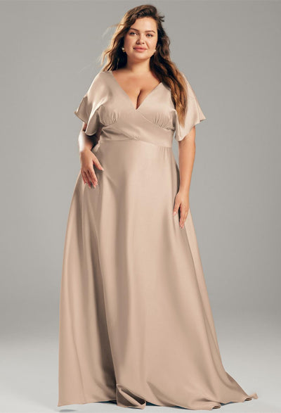 A plus size bridesmaid in a beige Nora - Satin Charmeuse Bridesmaid Dress - Off The Rack from Bergamot Bridal.