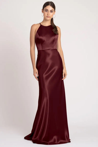 Woman model posing in an elegant high neckline Alessia - Bridesmaid Dress by Jenny Yoo evening gown from Bergamot Bridal.