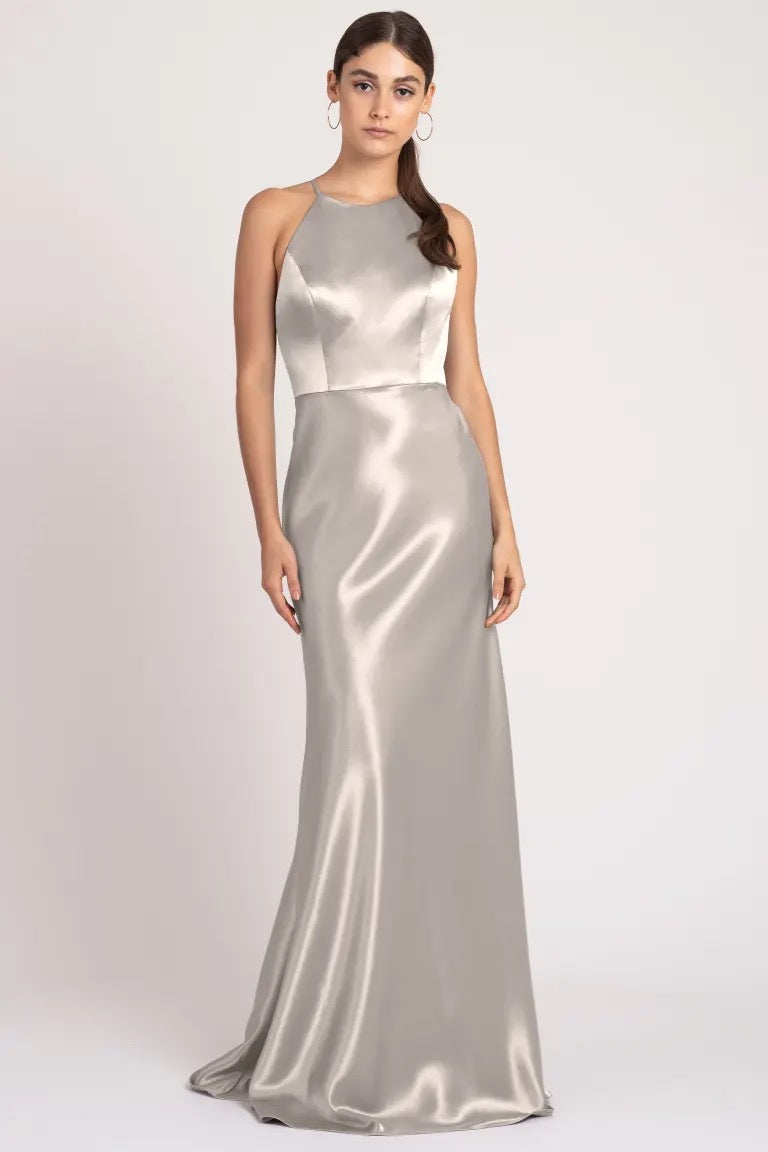 Woman in an elegant Alessia bridesmaid dress with a high neckline by Jenny Yoo at Bergamot Bridal.