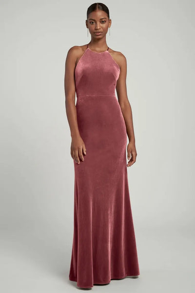 Woman wearing a Bailey velvet halter neckline evening gown.
Product Name: Bailey - Bridesmaid Dress by Jenny Yoo
Brand Name: Bergamot Bridal
