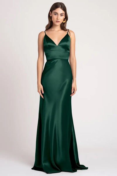 Woman posing in an elegant Bridesmaid Dress by Jenny Yoo made of satin back crepe fabric from Bergamot Bridal.