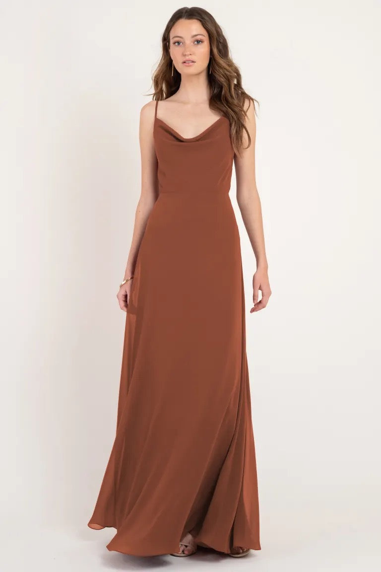 Woman modeling a long, brown, slip dress with a cowl neckline from Bergamot Bridal's Colby - Jenny Yoo Bridesmaid Dress.