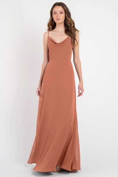 Woman posing in a Colby - Jenny Yoo Bridesmaid Dress from Bergamot Bridal, with a cowl neckline.